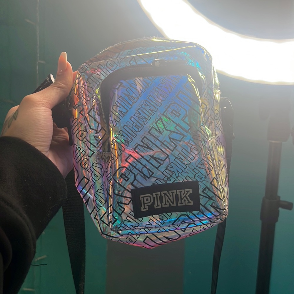 Multicolor, clear, pink purse with black handles